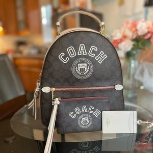 Coach varsity bag with matching wristlet and lanyard.